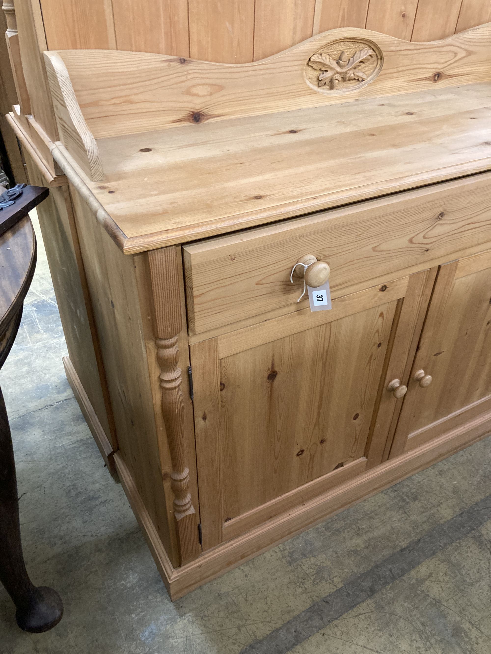 A reproduction pine sideboard, length 122cm, depth 40cm, height 106cm